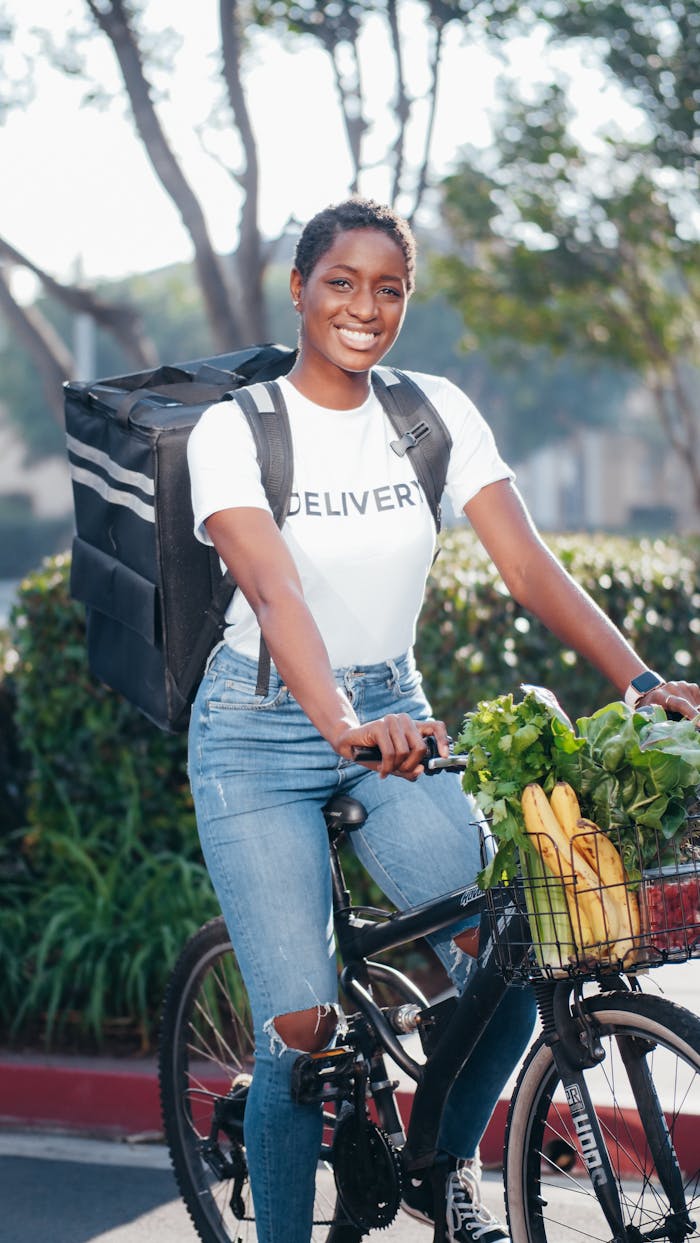Mastering the First Impression: Your intriguing post title goes here A cheerful delivery rider on a bicycle carrying fresh groceries in an outdoor setting.
